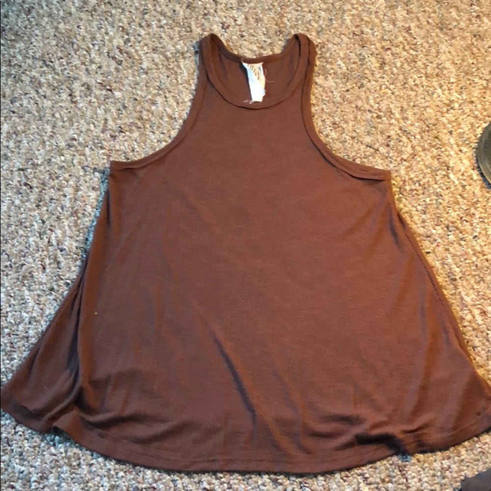 Never been worn free people tank top/ muscle tee